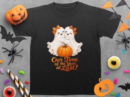 Black t-shirt with two hugging ghosts and pumpkin graphic that reads "Our Time of the Year, at Last!"