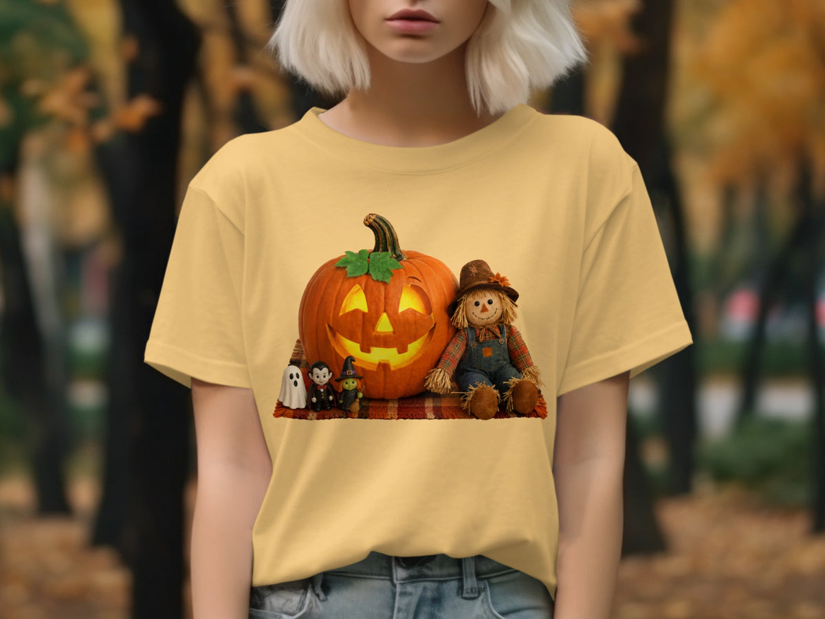 Jack-o'-lantern with ghost, vampire, witch, and scarecrow on plaid blanket.