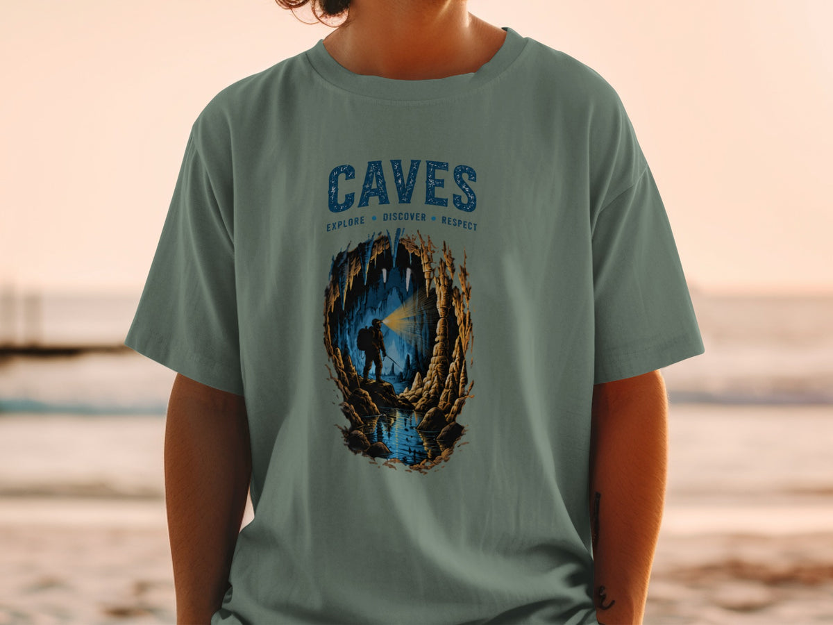 Cave illustration on t-shirt with text "CAVES" and "EXPLORE DISCOVER RESPECT"