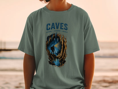 Cave illustration on t-shirt with text "CAVES" and "EXPLORE DISCOVER RESPECT"