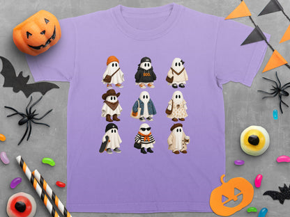 Lavender t-shirt with nine illustrated ghosts in various Halloween-themed outfits.