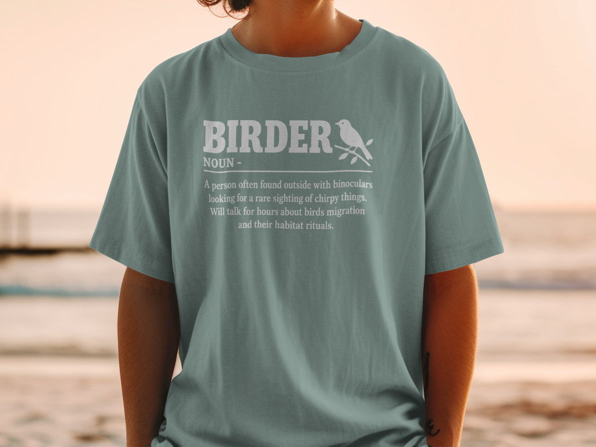 Teal t-shirt with "Birder Noun" definition and a bird illustration.