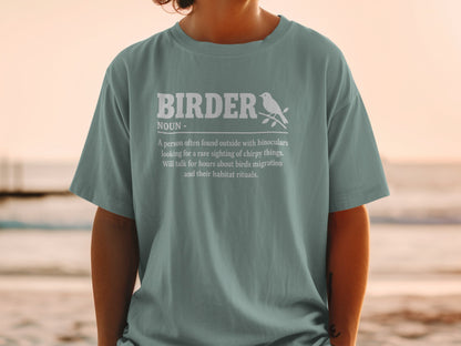 Teal t-shirt with "Birder Noun" definition and a bird illustration.