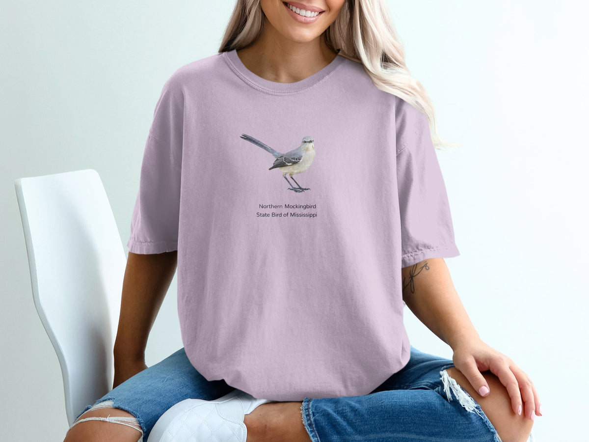 Northern Mockingbird, State Bird of Mississippi graphic on a lavender t-shirt.