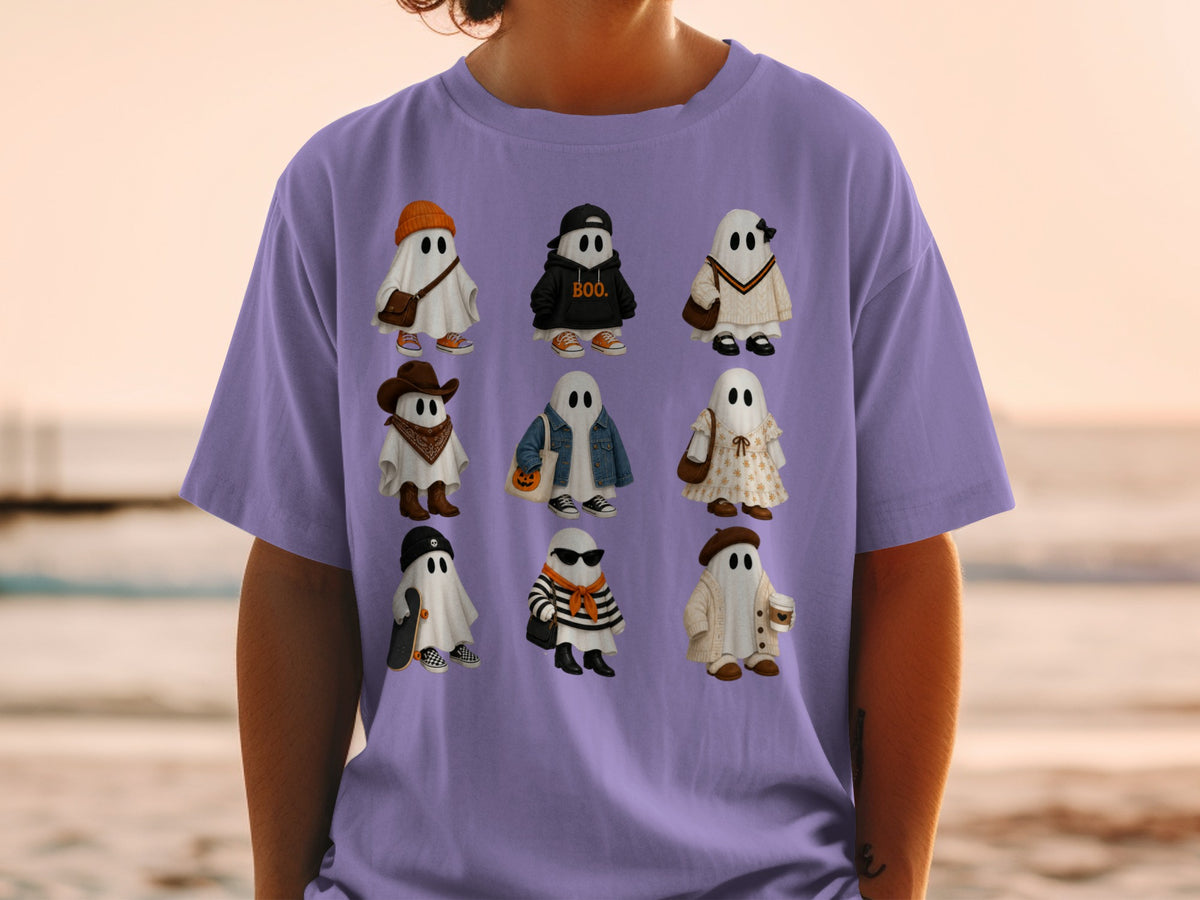 Nine cartoon ghosts in various Halloween-themed outfits on a purple t-shirt.