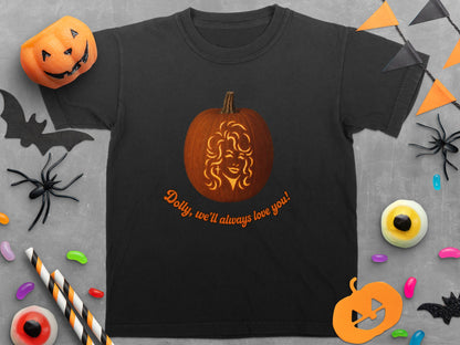 Black t-shirt with a carved pumpkin featuring Dolly Parton and text "Dolly, we'll always love you!".