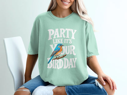 Mint green t-shirt with text "PARTY LIKE IT'S YOUR BIRDDAY" and a bluebird.