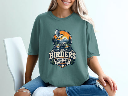 T-shirt graphic with binoculars, bird, mountains, and text: "Birders Ready When It Starts".