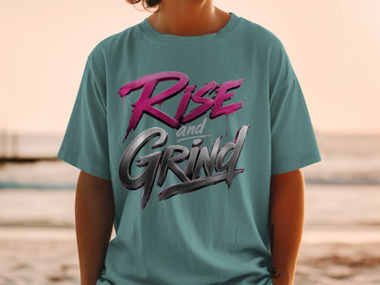 Teal t-shirt with "RISE and GRIND" graphic in pink and metallic gray.