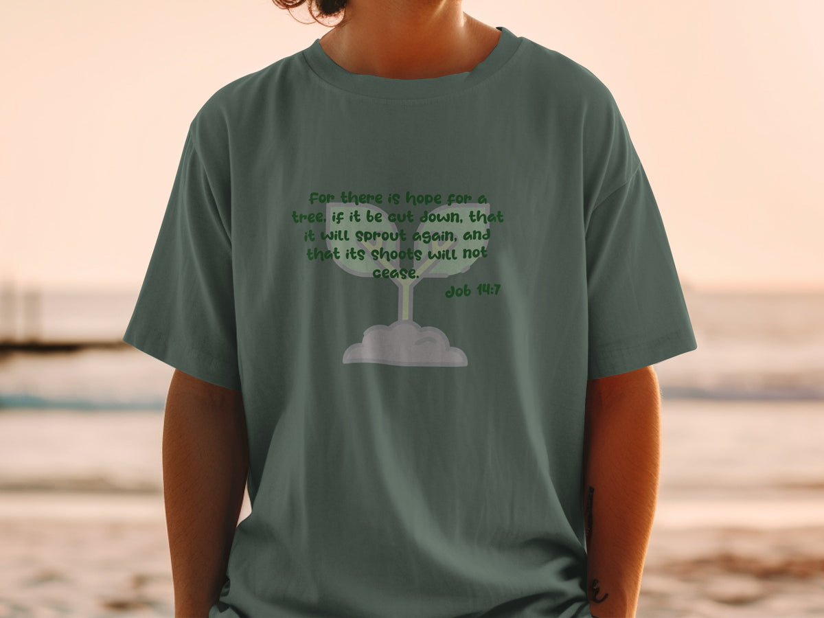 Green t-shirt with the Bible verse Job 14:7 about hope for a tree.