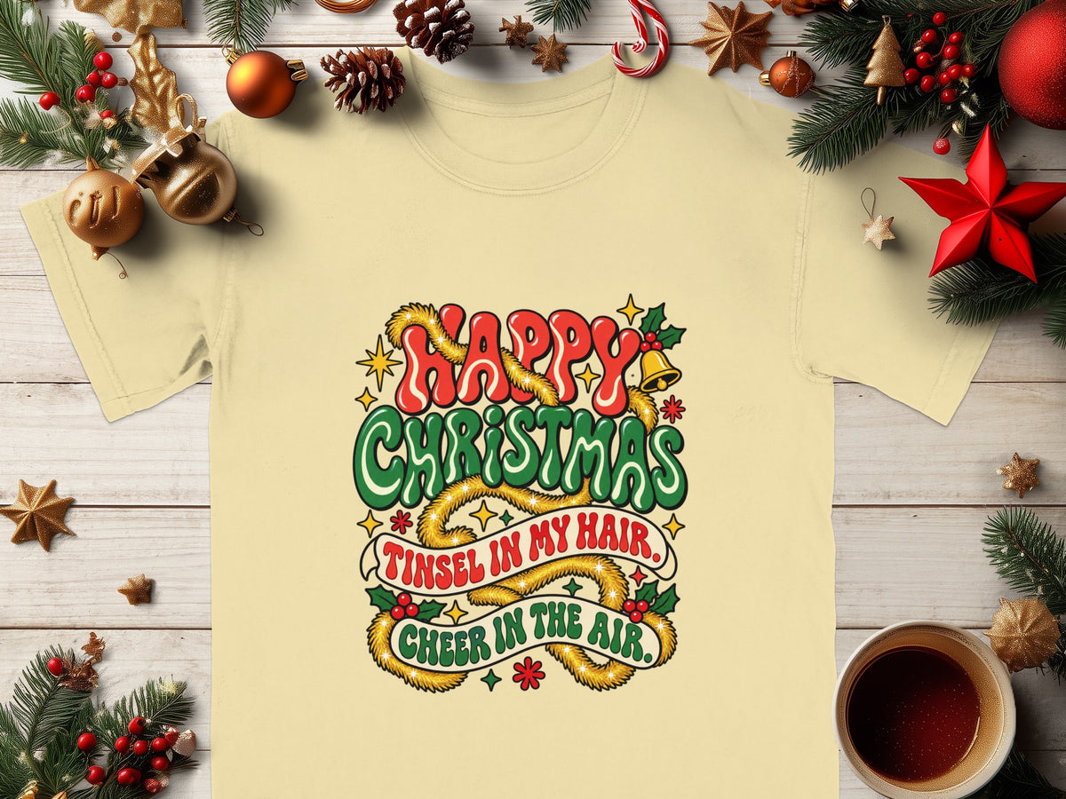 Light yellow t-shirt with Christmas graphic "Happy Christmas. Tinsel in my hair. Cheer in the air."