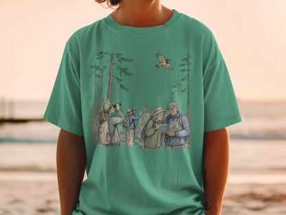 Birdwatching scene with people and flying bird on a green t-shirt.