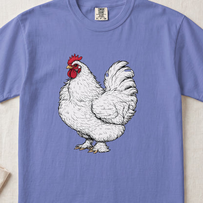 A periwinkle t-shirt featuring a detailed illustration of a white rooster centered on the chest.