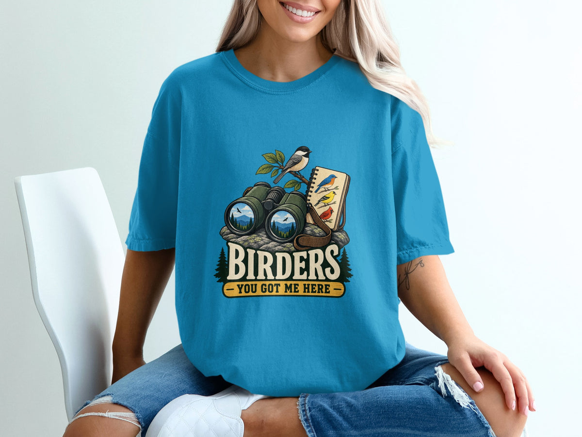 Binoculars, birds, and notebook graphic with "Birders You Got Me Here" text.