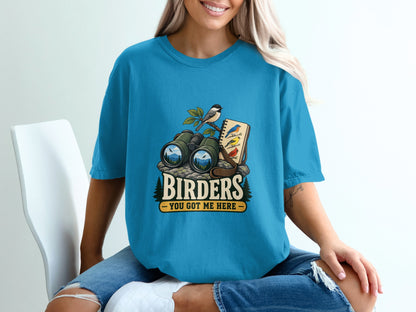 Binoculars, birds, and notebook graphic with "Birders You Got Me Here" text.