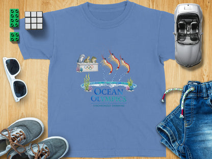 T-shirt featuring "Ocean Olympics Synchronized Swimming" graphic with sea creatures and shrimp.