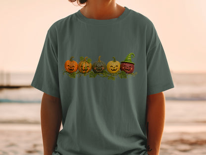 Five smiling pumpkins with carved faces are displayed on a vine with leaves.