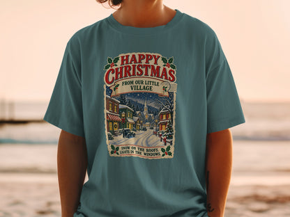 T-shirt with "Happy Christmas from Our Little Village" and snowy village scene.