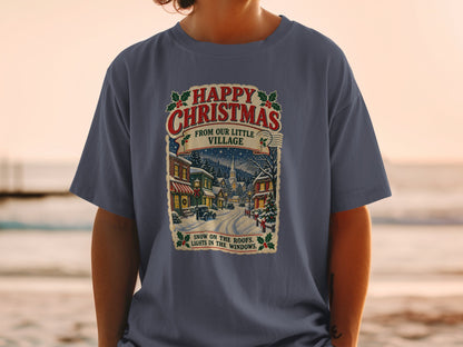 T-shirt with "Happy Christmas From Our Little Village" text and snowy village scene.