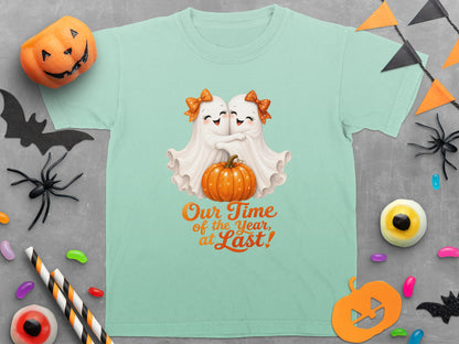 Teal t-shirt with two hugging ghosts, a pumpkin, and "Our Time of the Year, at Last!"