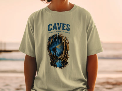 T-shirt with "CAVES EXPLORE DISCOVER RESPECT" and cave explorer graphic.