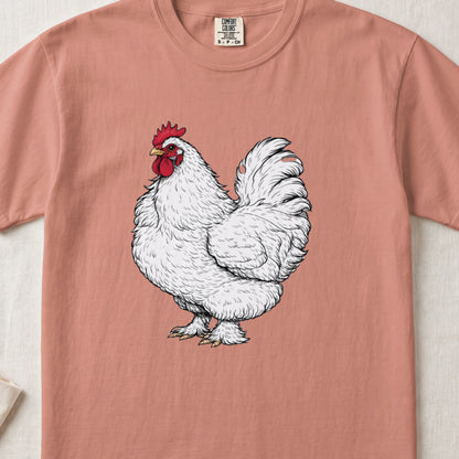 A salmon-pink t-shirt featuring a detailed illustration of a white rooster centered on the chest.
