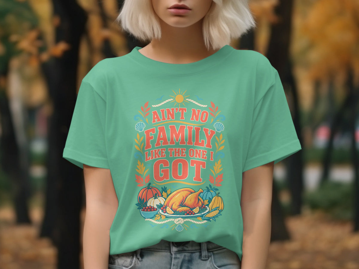 Teal t-shirt with "Ain't No Family Like The One I Got" and Thanksgiving meal graphic.