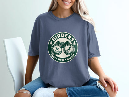 T-shirt with round graphic of binoculars, birds, and text "BIRDER" and "Spot. Note. Repeat."