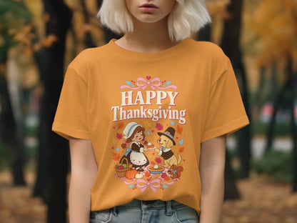 Orange t-shirt with "Happy Thanksgiving" graphic of a girl and dog sharing pie.