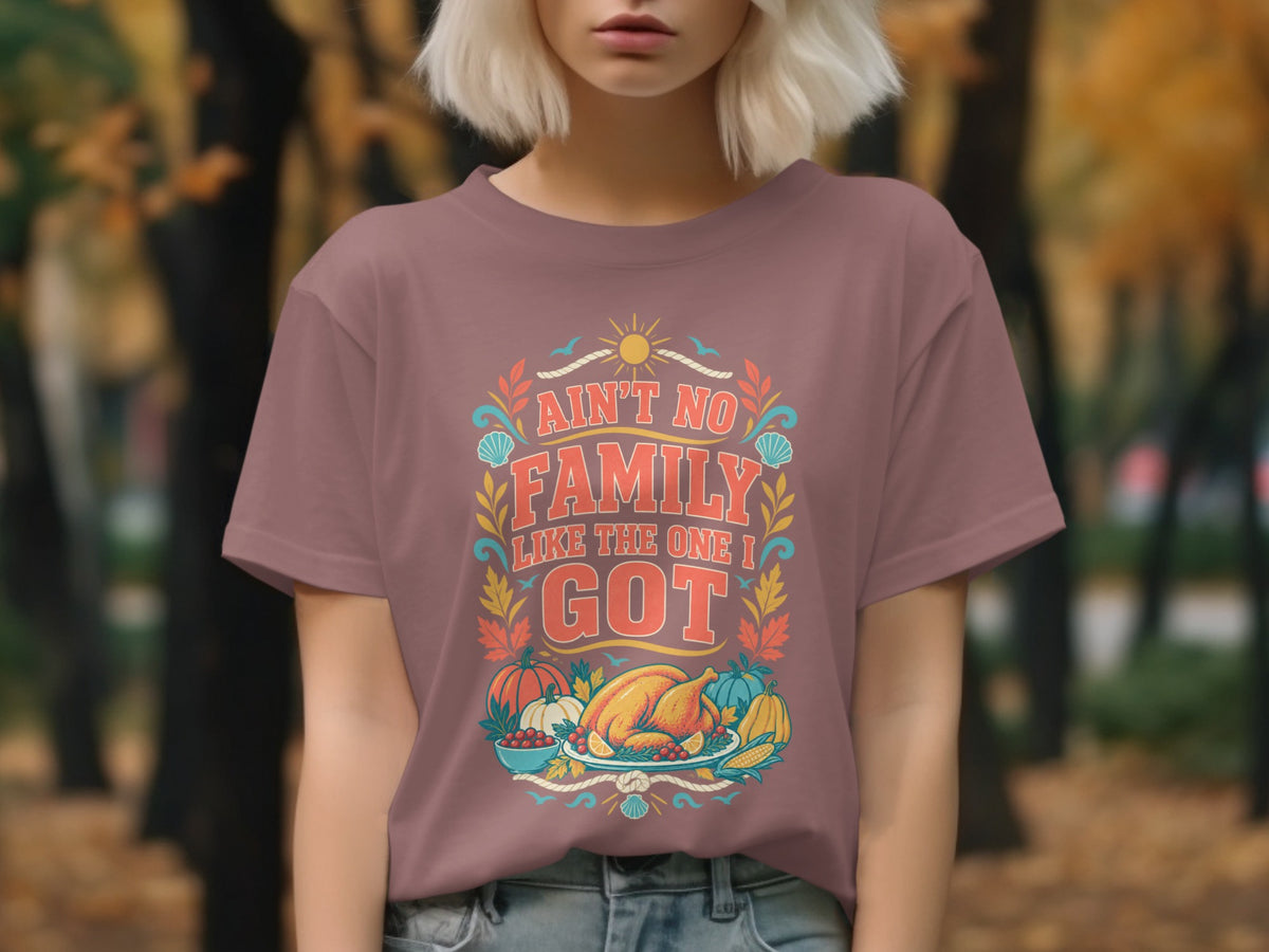 "Ain't No Family Like The One I Got" text with Thanksgiving food graphic on a t-shirt.