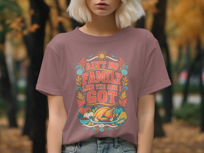 "Ain't No Family Like The One I Got" text with Thanksgiving food graphic on a t-shirt.