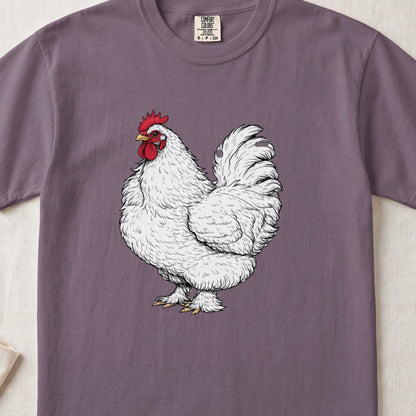 A mauve-colored short-sleeved t-shirt features a vintage-style illustration of a white rooster centered on the chest.