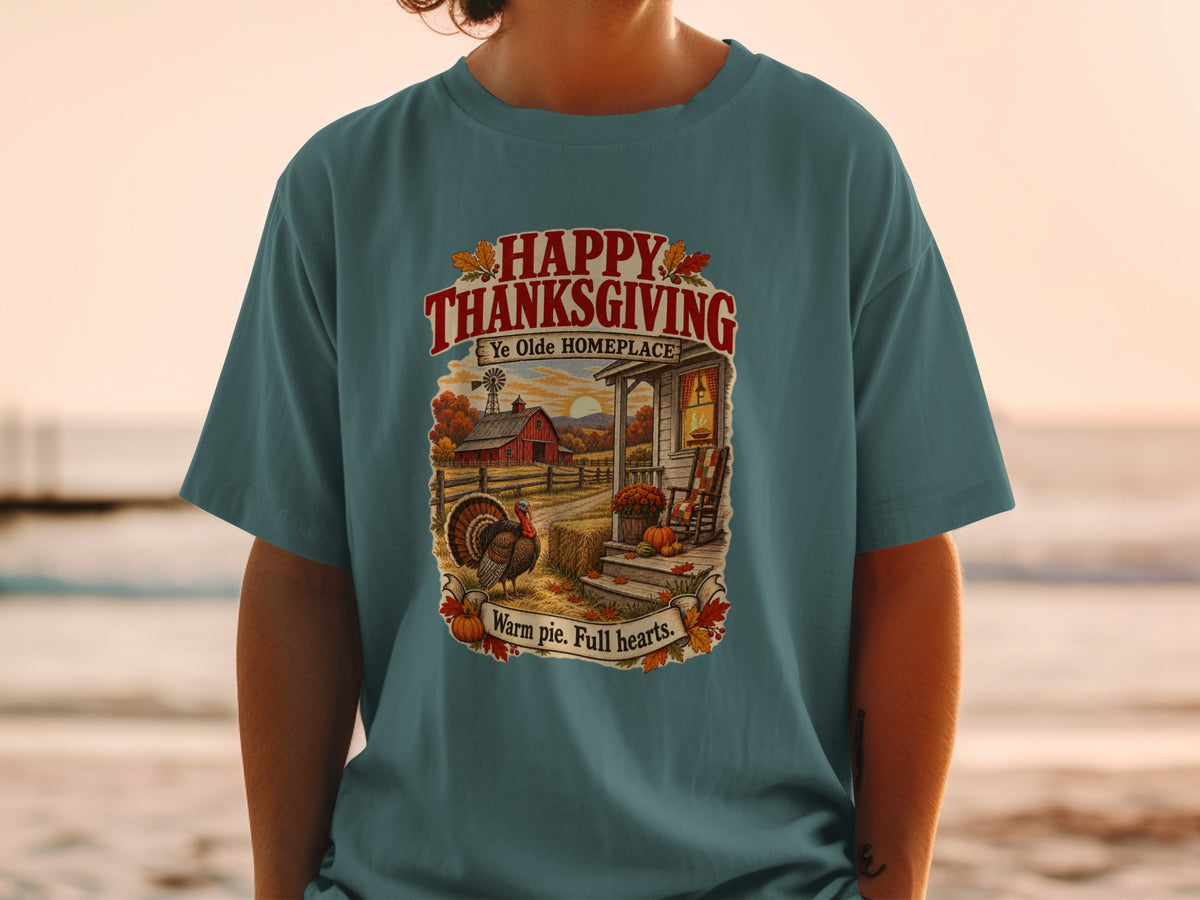 Thanksgiving t-shirt with farmhouse scene and text "Happy Thanksgiving Ye Olde Homeplace".