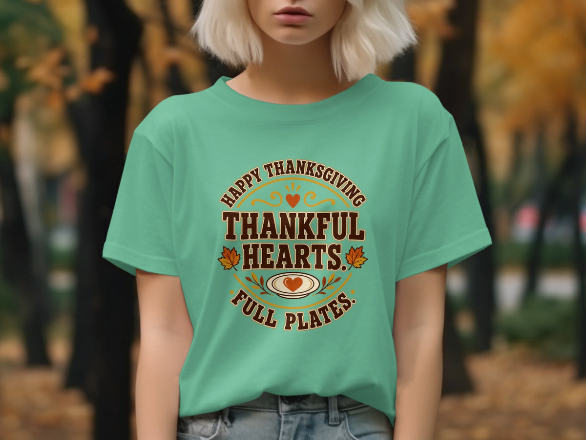 Turquoise t-shirt with "Happy Thanksgiving Thankful Hearts Full Plates" text and Thanksgiving graphics.