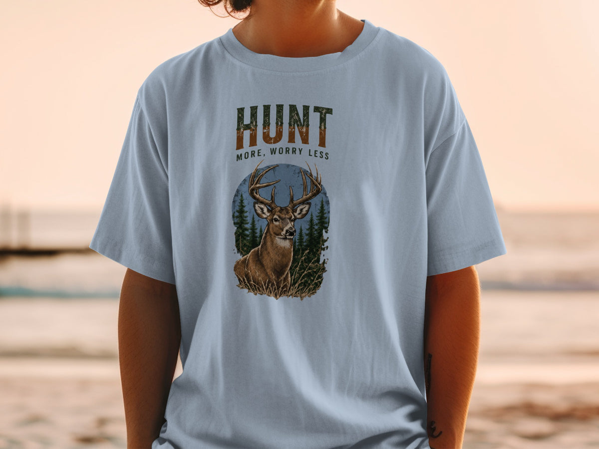 Light blue t-shirt with "HUNT MORE, WORRY LESS" and a deer in a forest oval.