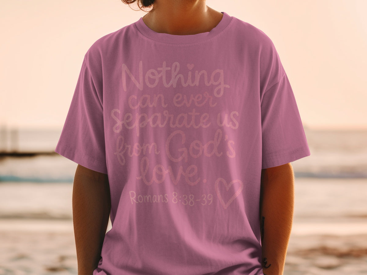 Mauve t-shirt with "Nothing can ever separate us from God's love. Romans 8:38-39" text.