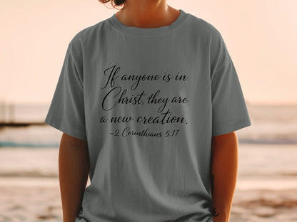 Grey t-shirt with text "If anyone is in Christ, they are a new creation. -2 Corinthians 5:17"