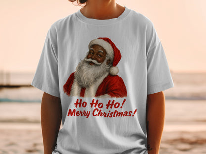 Santa Claus graphic with text "Ho Ho Ho! Merry Christmas!" on white t-shirt.