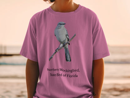 Northern Mockingbird, State Bird of Florida graphic on a pink t-shirt.