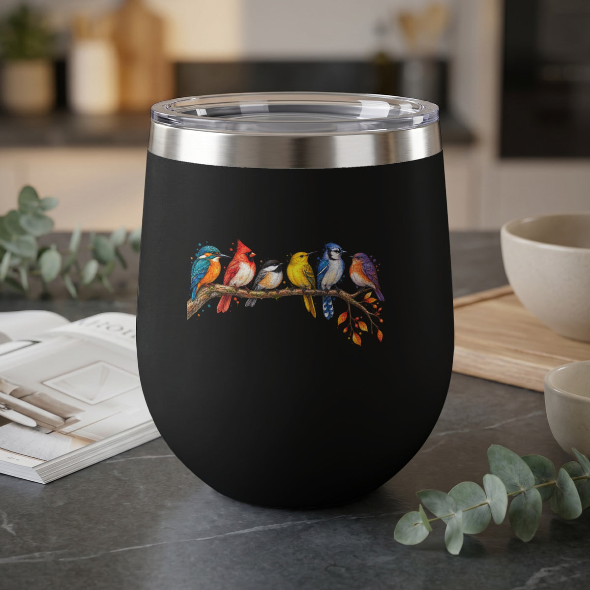Black tumbler with a detailed illustration of six colorful birds perched on a branch.