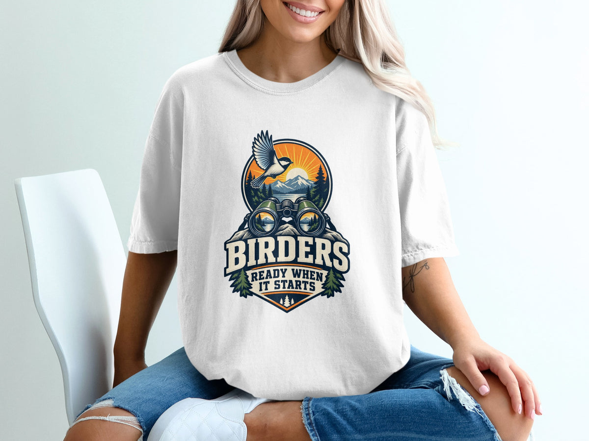 White t-shirt with graphic: "BIRDER'S READY WHEN IT STARTS" and binoculars.