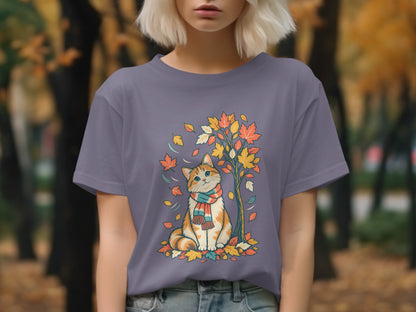 Cat wearing a scarf sits under a tree with colorful autumn leaves.