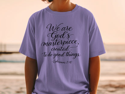 Purple t-shirt with "We are God's masterpiece, created... to do good things. -Ephesians 2:10".