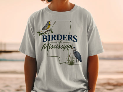 T-shirt graphic with "Birders of Mississippi" text and illustrated birds and state outline.