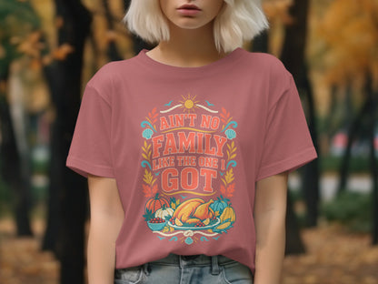 Pink t-shirt with "Ain't No Family Like The One I Got" text and Thanksgiving harvest illustration.