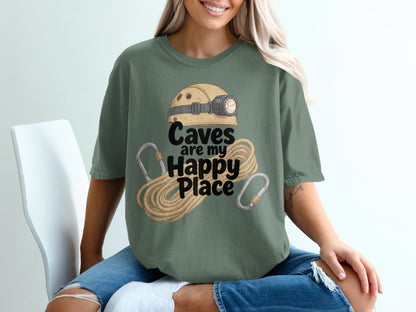 Green t-shirt with cave helmet, rope, carabiners, and text "Caves are my Happy Place".