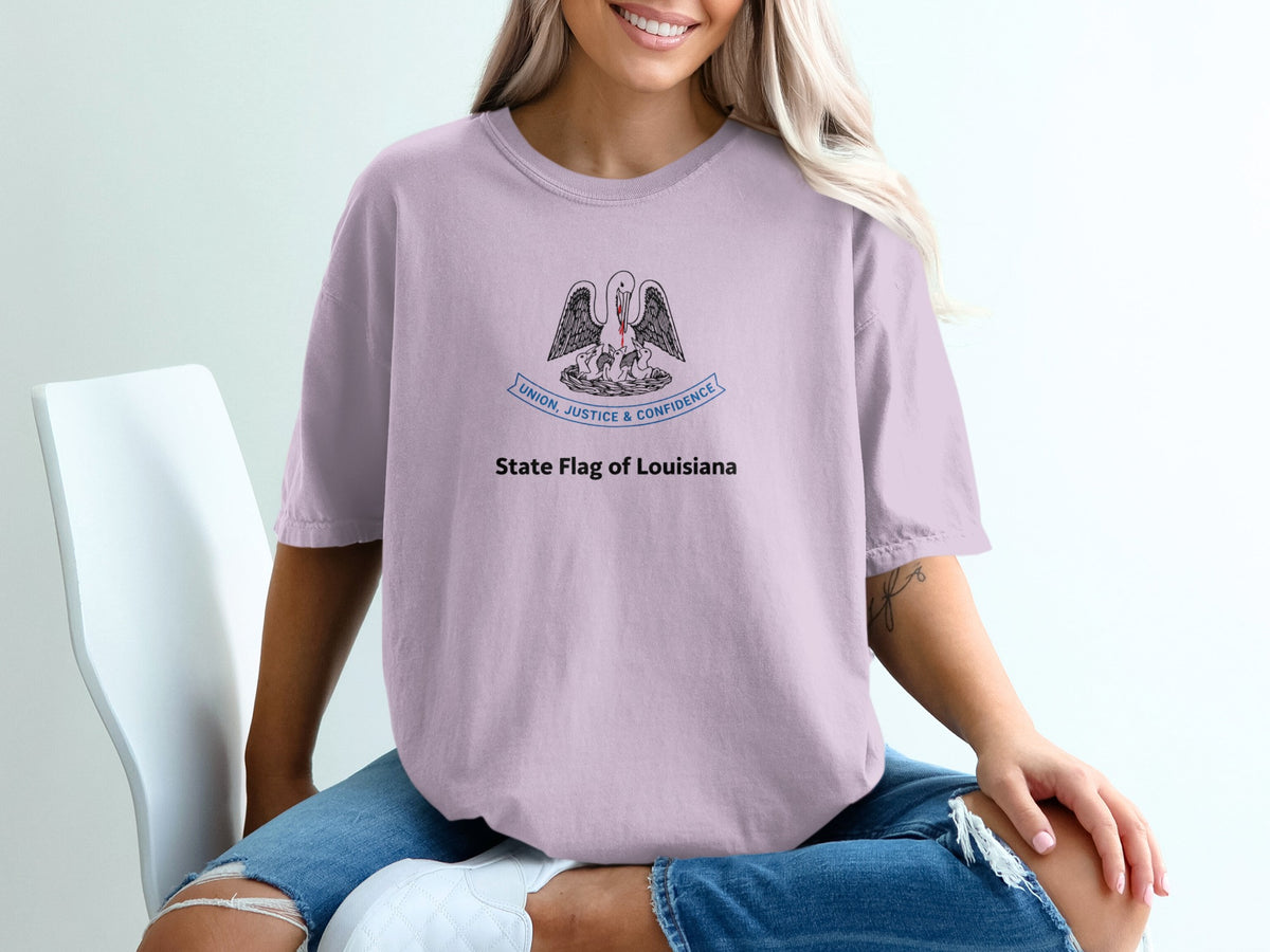 Light purple t-shirt featuring the Louisiana state flag emblem and text.
