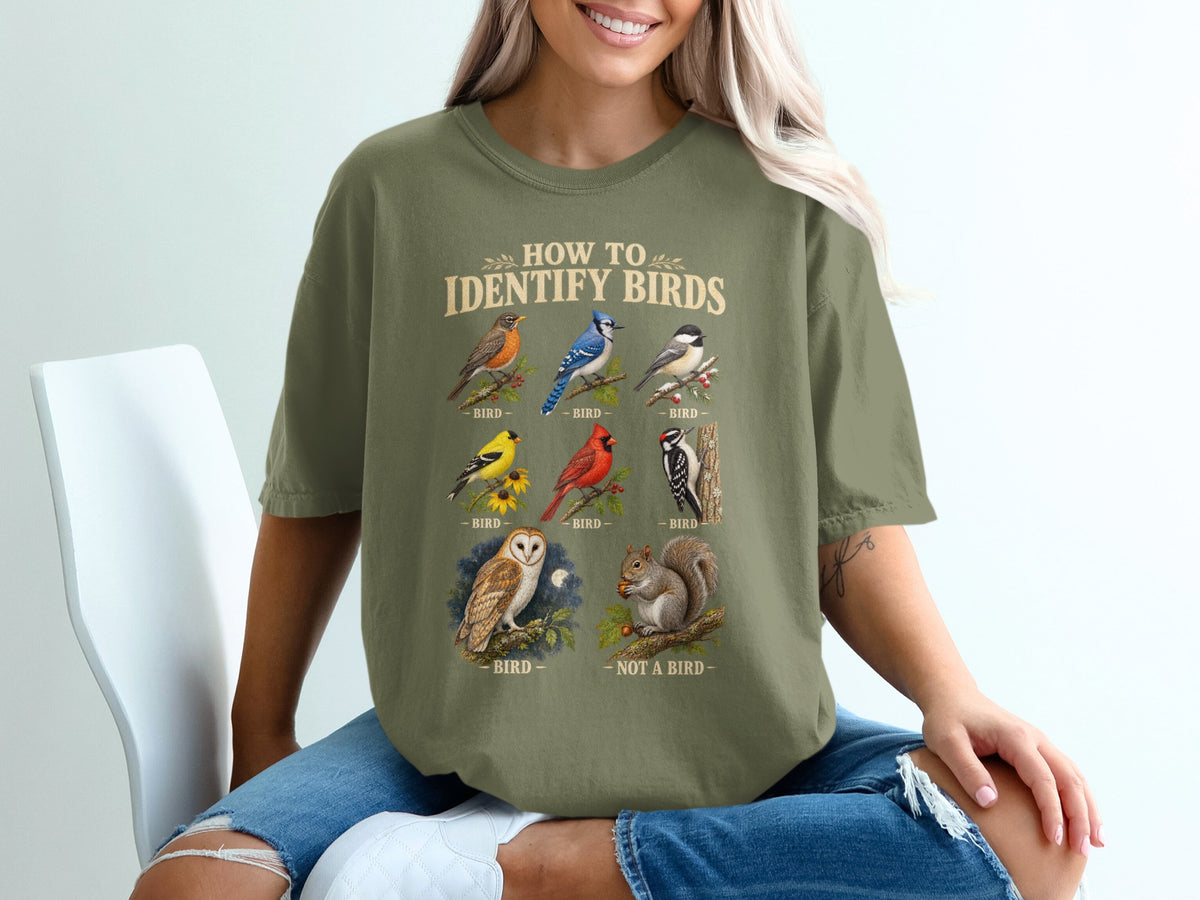T-shirt with "How to Identify Birds" and illustrations of birds and a squirrel.