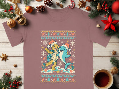 Turtle and dolphin wearing Santa hats with a festive ocean-themed ugly Christmas sweater design.