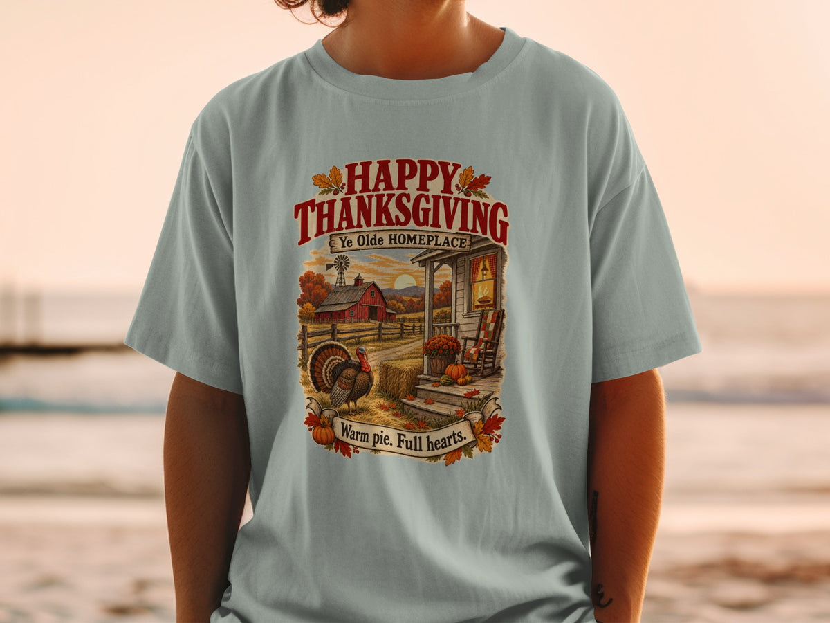 Thanksgiving t-shirt with farm scene, turkey, and text "Happy Thanksgiving Ye Olde Homeplace Warm pie. Full hearts."